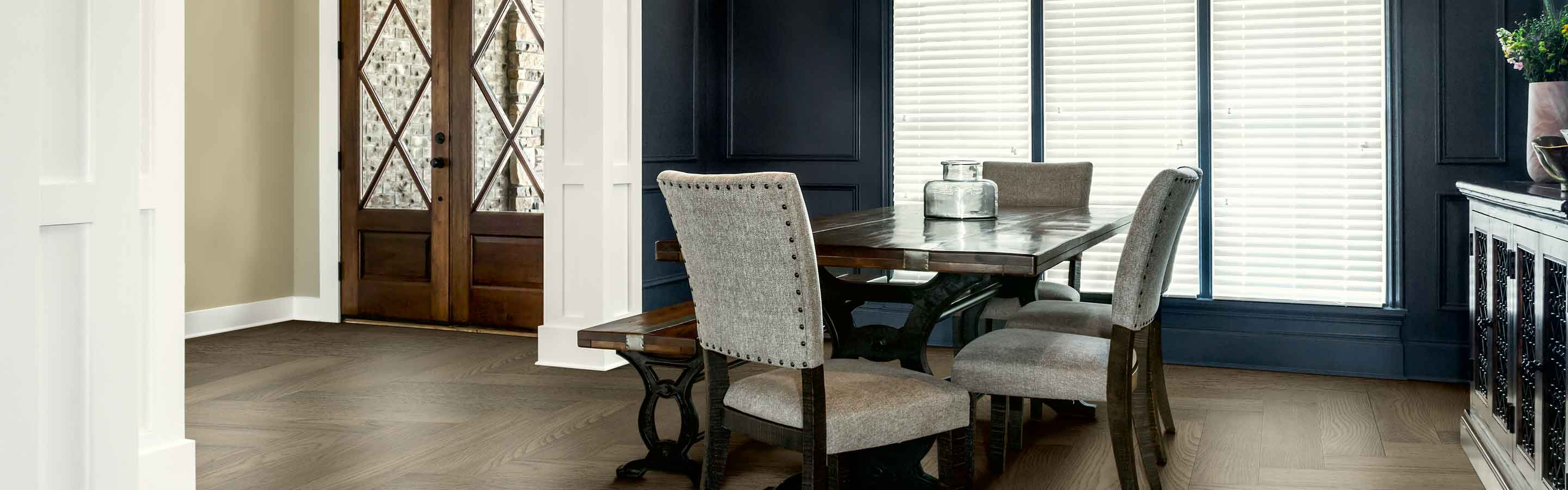 entryway and dining room with large window and blinds